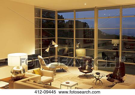 Modern living room with tall windows View Large Photo Image Stock Photography - Modern living room with tall windows. Fotosearch