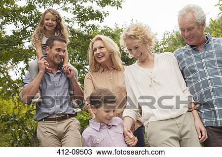 Multi-generation family walking together outdoors View Large Photo Image Stock Image - Multi-generation family walking together outdoors. Fotosearch