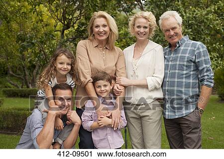 Portrait of multi-generation family smiling outdoors View Large Photo Image Stock Image - Portrait of multi-generation family smiling outdoors. Fotosearch