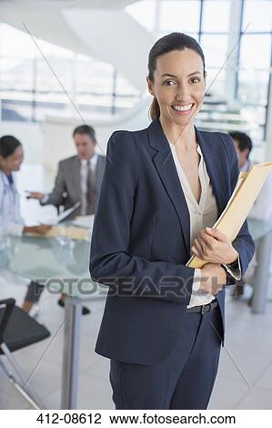 Portrait of smiling businesswoman in meeting View Large Photo Image Stock Image - Portrait of smiling businesswoman in meeting. Fotosearch