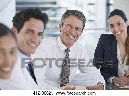 Portrait of smiling doctors and business people in meeting View Large Photo Image Stock Photography - Portrait of smiling doctors and business people in meeting. Fotosearch