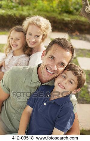 Portrait of smiling family outdoors View Large Photo Image Stock Photo - Portrait of smiling family outdoors. Fotosearch