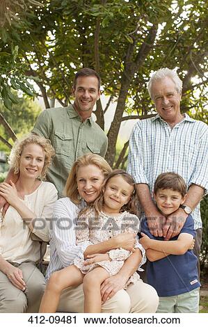 Stock Image - Portrait of smiling multi-generation family. Fotosearch