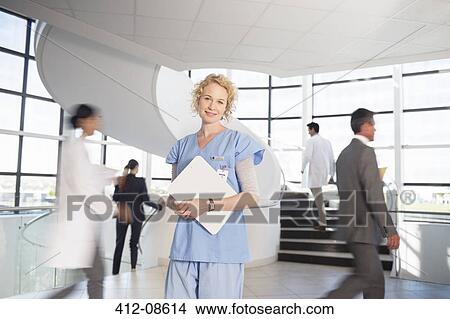 Portrait of smiling nurse in hospital View Large Photo Image Picture - Portrait of smiling nurse in hospital. Fotosearch