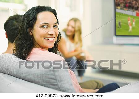 Portrait of smiling woman on sofa View Large Photo Image Stock Image - Portrait of smiling woman on sofa. Fotosearch