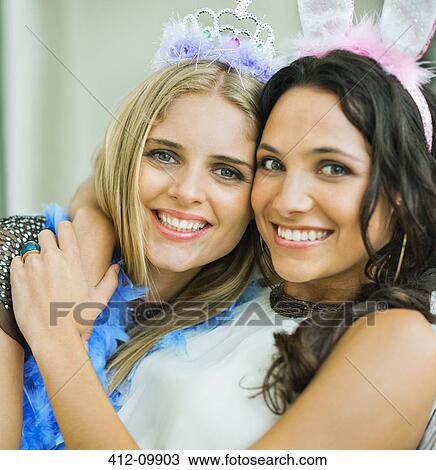Portrait of smiling women wearing tiara and bunny ears View Large Photo Image Stock Image - Portrait of smiling women wearing tiara and bunny ears. Fotosearch