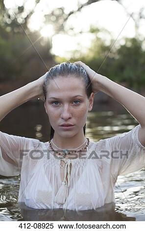 Portrait of woman in river View Large Photo Image Stock Photography - Portrait of woman in river. Fotosearch