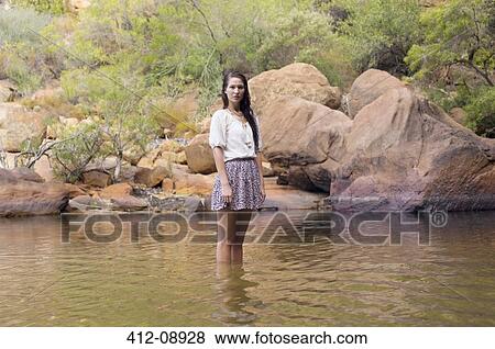 Portrait of woman wading in river View Large Photo Image Stock Photo - Portrait of woman wading in river. Fotosearch