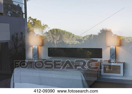 Reflection of trees on modern bedroom window View Large Photo Image Stock Image - Reflection of trees on modern bedroom window. Fotosearch