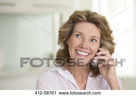 Senior woman talking on telephone View Large Photo Image Stock Image - Senior woman talking on telephone. Fotosearch