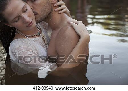 Sensual couple kissing in lake View Large Photo Image Stock Image - Sensual couple kissing in lake. Fotosearch