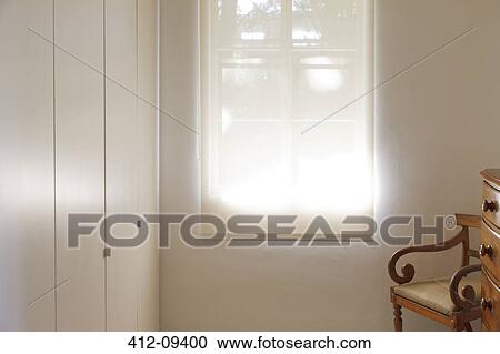 Stock Image - Shade pulled down over window. Fotosearch