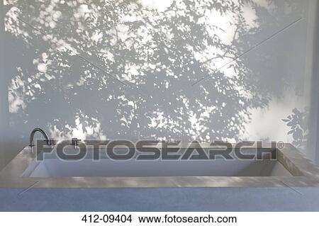 Shadows of trees on curtain behind bathtub View Large Photo Image Picture - Shadows of trees on curtain behind bathtub. Fotosearch