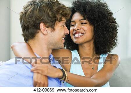 Smiling couple hugging View Large Photo Image Stock Photo - Smiling couple hugging. Fotosearch