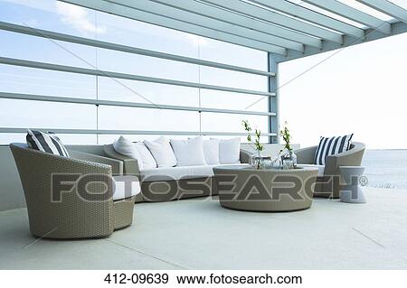 Sofa and chairs on modern patio View Large Photo Image Stock Photo - Sofa and chairs on modern patio. Fotosearch