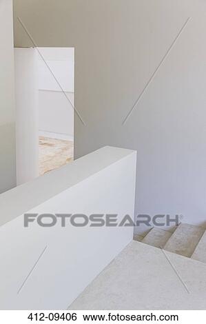 Staircase and half walls of modern house View Large Photo Image Stock Photograph - Staircase and half walls of modern house. Fotosearch