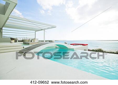 Swimming pool overlooking ocean View Large Photo Image Stock Image - Swimming pool overlooking ocean. Fotosearch