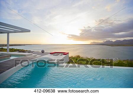 Swimming pool overlooking ocean View Large Photo Image Stock Photo - Swimming pool overlooking ocean. Fotosearch