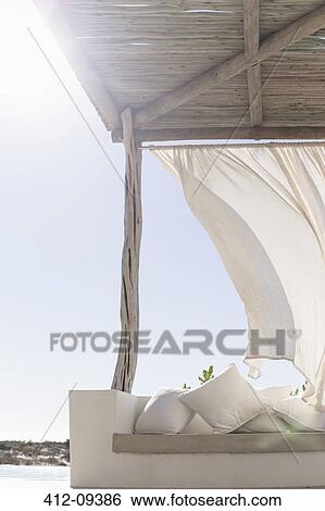 Wind blowing curtain on sunny patio View Large Photo Image Stock Photograph - Wind blowing curtain on sunny patio. Fotosearch