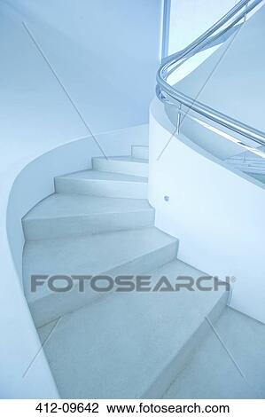 Winding staircase in modern house View Large Photo Image Stock Image - Winding staircase in modern house. Fotosearch