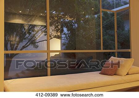 Window seat overlooking courtyard View Large Photo Image Stock Photo - Window seat overlooking courtyard. Fotosearch