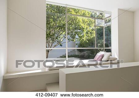 Stock Photo - Window seat overlooking trees. Fotosearch