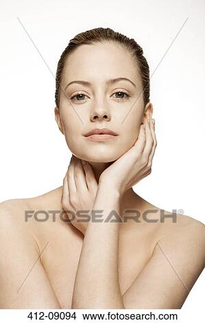 Picture - Woman holding her neck. Fotosearch