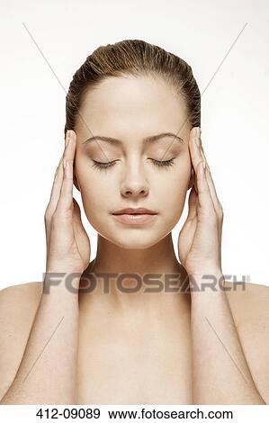 Woman rubbing her temples View Large Photo Image Stock Photo - Woman rubbing her temples. Fotosearch