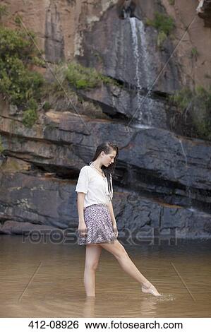 Woman wading in pool View Large Photo Image Stock Photograph - Woman wading in pool. Fotosearch