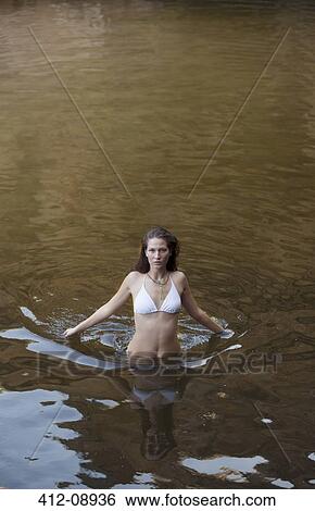 Woman wading in river View Large Photo Image Stock Photograph - Woman wading in river. Fotosearch