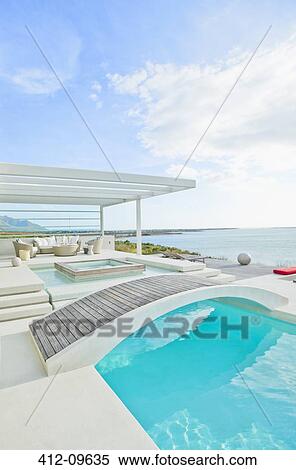 Wooden footbridge over luxury swimming pool View Large Photo Image Stock Photography - Wooden footbridge over luxury swimming pool. Fotosearch