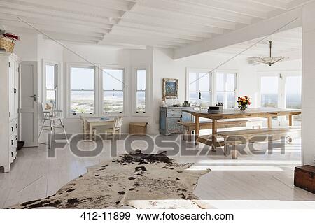 Animal skin rug in sunny dining room View Large Photo Image Stock Photo - Animal skin rug in sunny dining room. Fotosearch