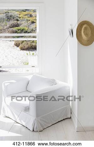 Armchair next to window overlooking beach View Large Photo Image Stock Photograph - Armchair next to window overlooking beach. Fotosearch