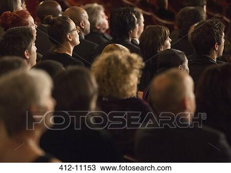 Stock Image - Attentive theater audience. Fotosearch