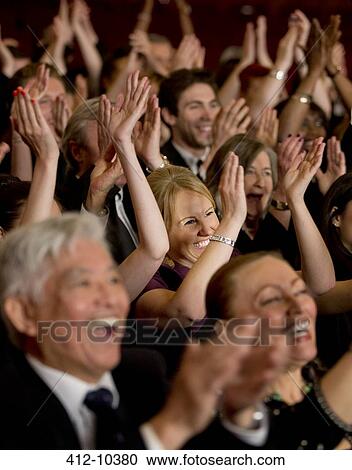 Stock Image - Audience clapping in theater. Fotosearch