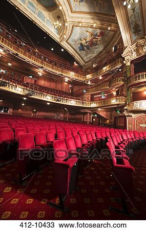 Balconies, seats and ornate ceiling in empty theater auditorium View Large Photo Image Stock Image - Balconies, seats and ornate ceiling in empty theater auditorium. Fotosearch