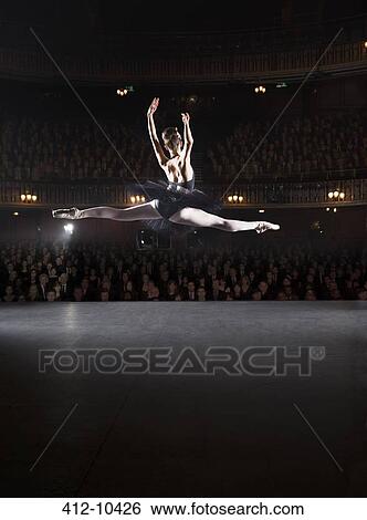 Ballerina mid-air on theater stage View Large Photo Image Stock Photograph - Ballerina mid-air on theater stage. Fotosearch