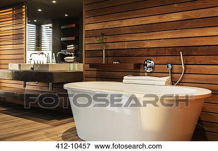 Stock Photo - Bathtub and sink in modern bathroom. Fotosearch