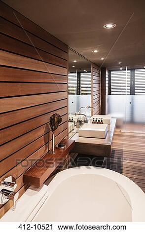 Stock Image - Bathtub and sinks in modern bathroom. Fotosearch