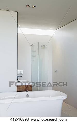 Bathtub, shower and sink in modern bathroom View Large Photo Image Stock Image - Bathtub, shower and sink in modern bathroom. Fotosearch