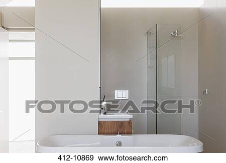 Bathtub, shower and sink in modern bathroom View Large Photo Image Stock Photo - Bathtub, shower and sink in modern bathroom. Fotosearch