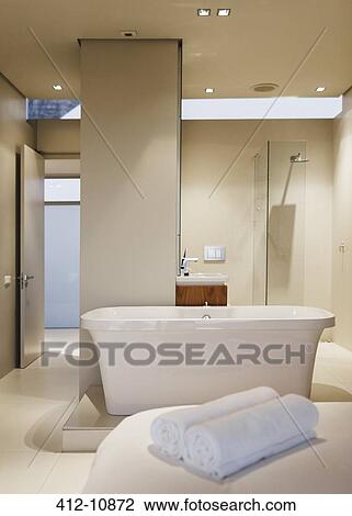 Bathtub, sink and shower in modern bathroom View Large Photo Image Stock Image - Bathtub, sink and shower in modern bathroom. Fotosearch