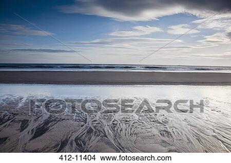 Beach at low tide View Large Photo Image Picture - Beach at low tide. Fotosearch