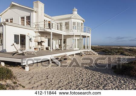 Beach house overlooking ocean View Large Photo Image Picture - Beach house overlooking ocean. Fotosearch