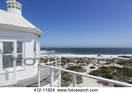 Picture - Beach house overlooking ocean. Fotosearch