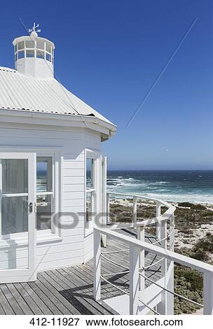Stock Photo - Beach house overlooking ocean. Fotosearch