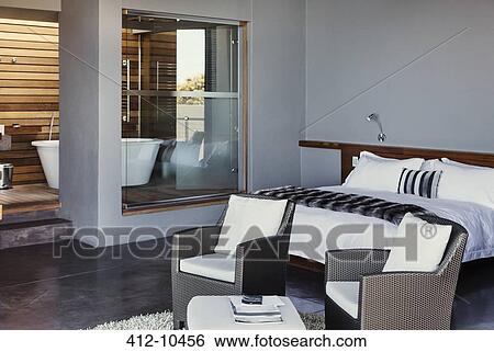 Bed and armchairs in modern bedroom View Large Photo Image Stock Photograph - Bed and armchairs in modern bedroom. Fotosearch