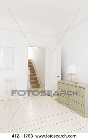 Stock Photo - Bedroom door leading to staircase. Fotosearch