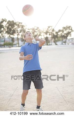 Boy heading soccer ball View Large Photo Image Stock Photo - Boy heading soccer ball. Fotosearch