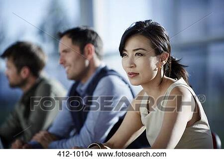 Business people sitting in meeting View Large Photo Image Picture - Business people sitting in meeting. Fotosearch
